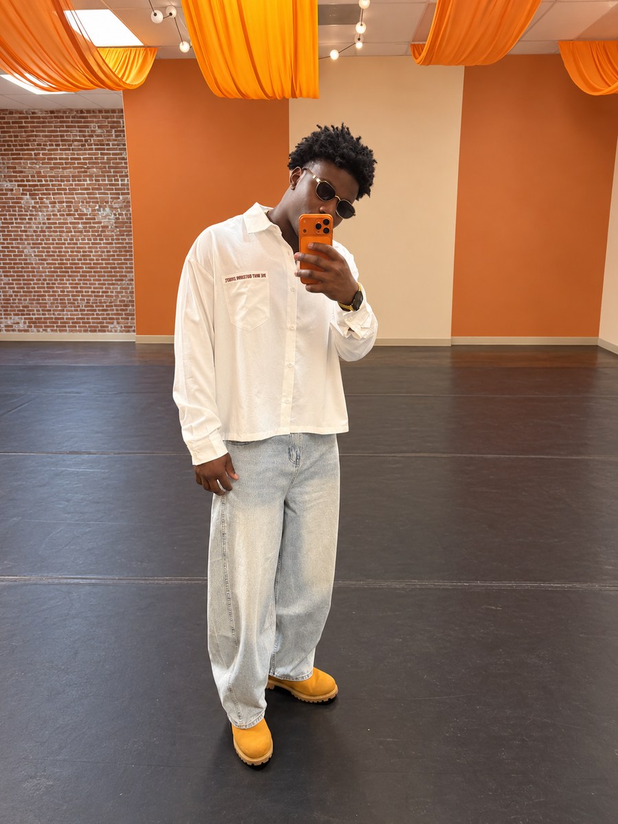 FMB customer wearing an ivory button-up and denim